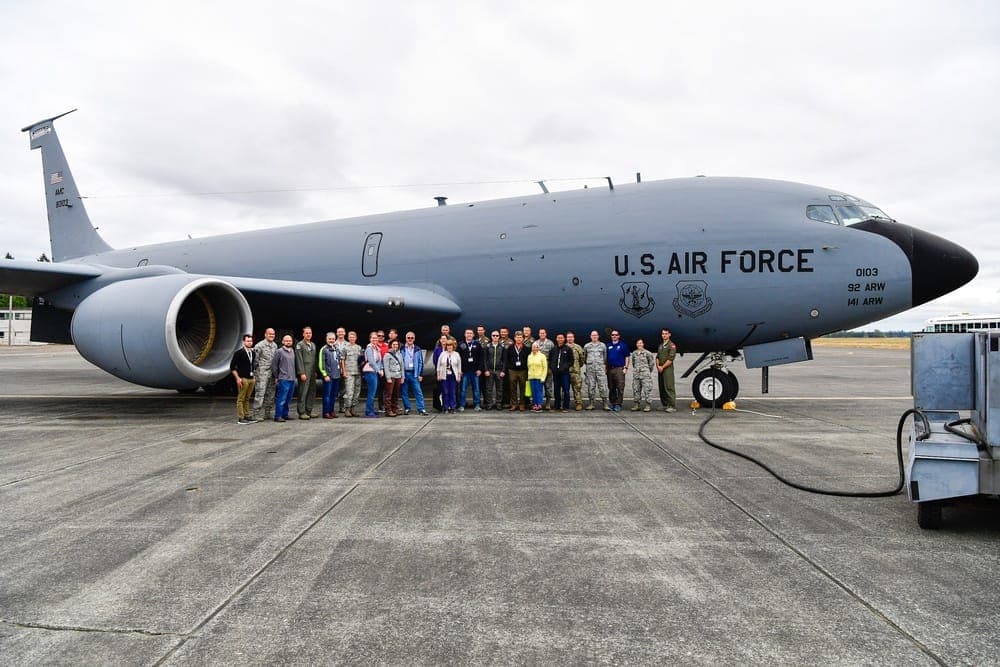 Civilian employers aboard a KC-135 Stratotanker during an ESGR Bosslift event observing aerial refueling operations