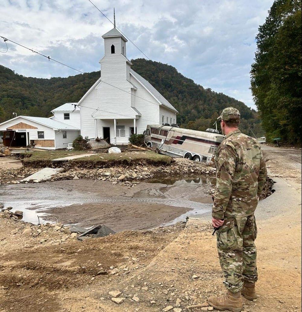 Air National Guard Airman surveying hurricane damage during Hurricane Helene response operations in North Carolina