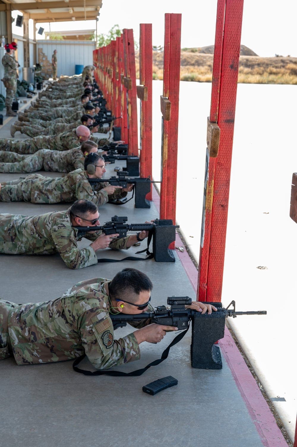 Air Force Reserve members conducting weapons qualification during annual training