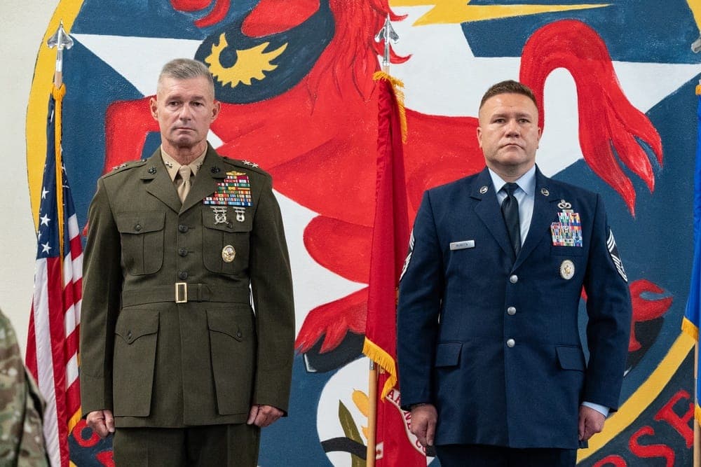 Air Force commander pinning a medal on an Airman during an awards ceremony