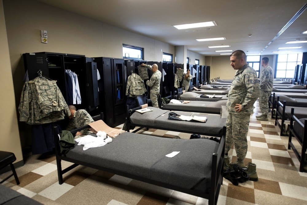 Airmen during dormitory inspection demonstrating attention to detail