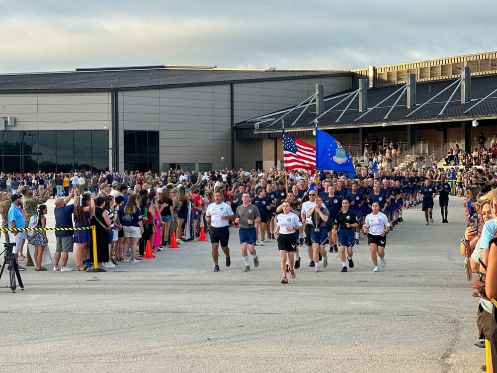 Air Force trainees running in formation during the Airman's Run at Pfingston Reception Center, JBSA-Lackland