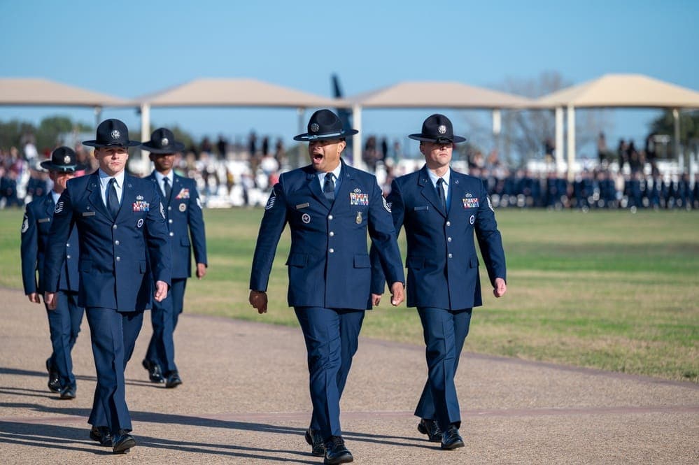 Airmen in dress uniform marching during BMT Graduation Parade at JBSA-Lackland