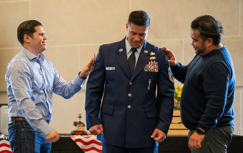 Chief Master Sergeant receiving new rank during a promotion ceremony