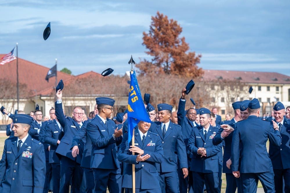 Newly commissioned officers celebrating at OTS graduation ceremony at Maxwell AFB