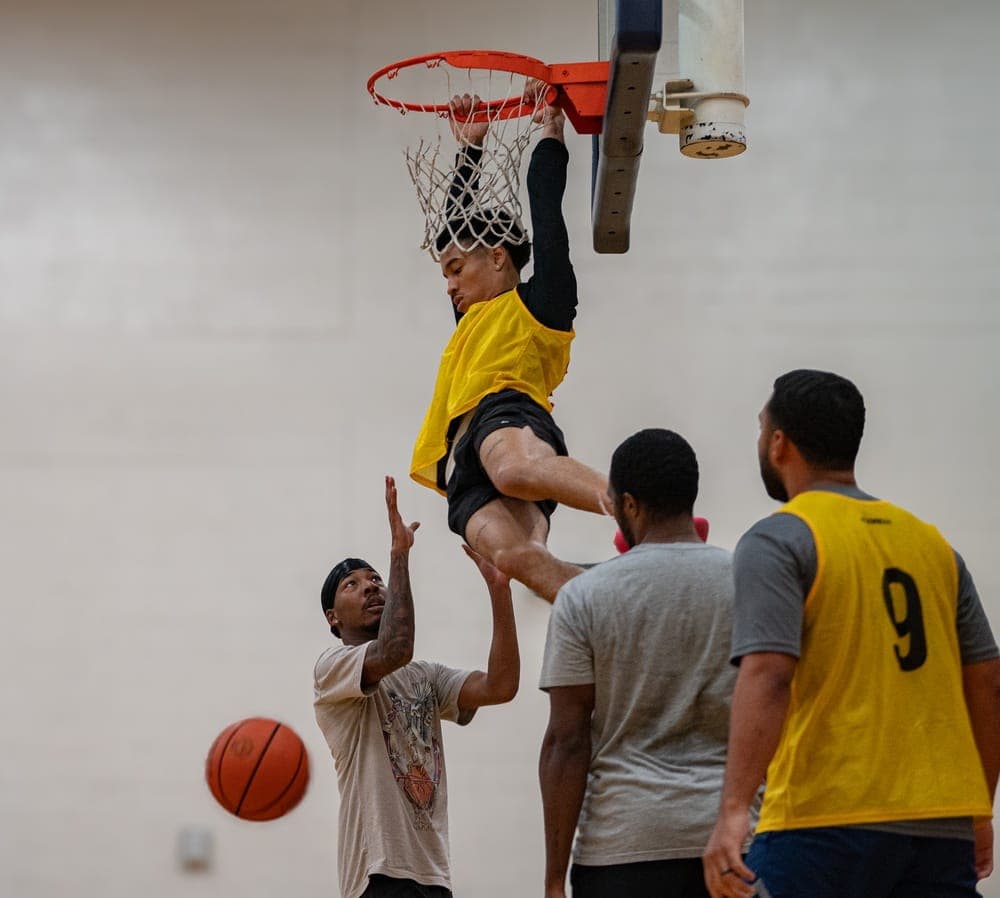 Airmen demonstrating wingman culture through teamwork during a unit event