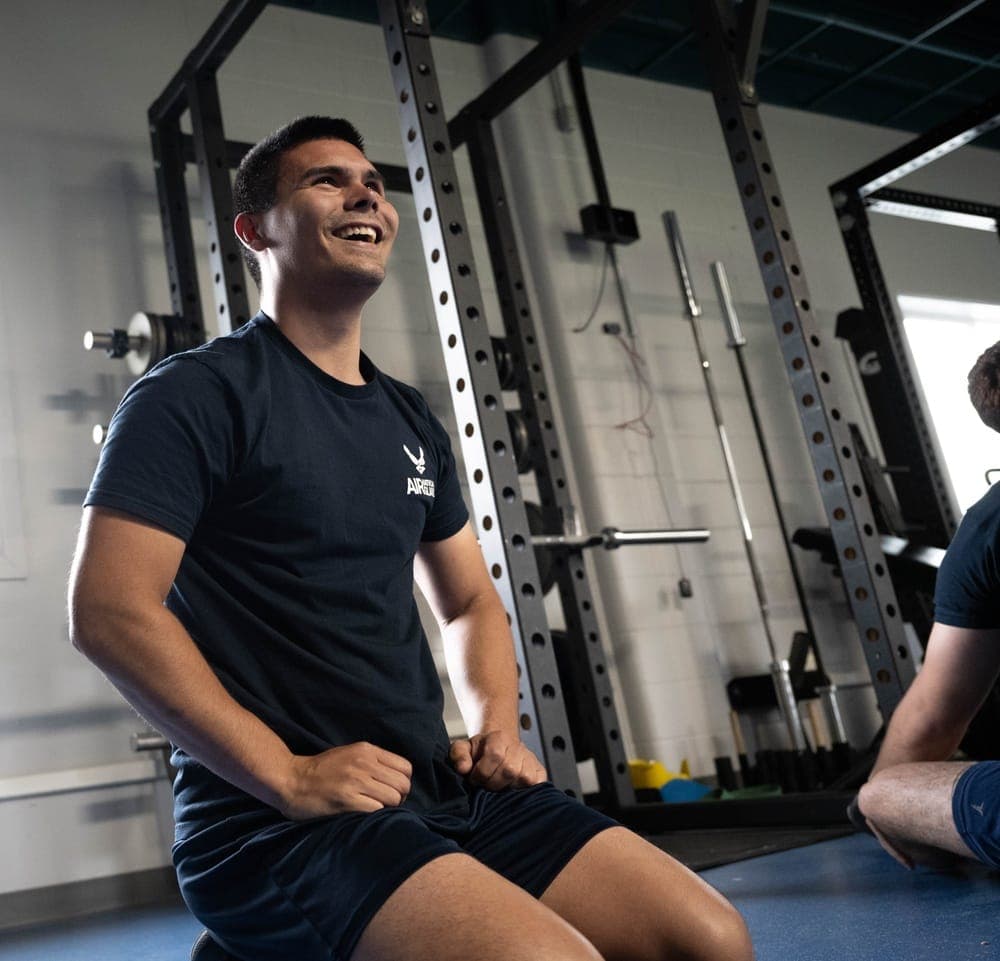 Air Force recruits participating in physical training during a DEP fitness session