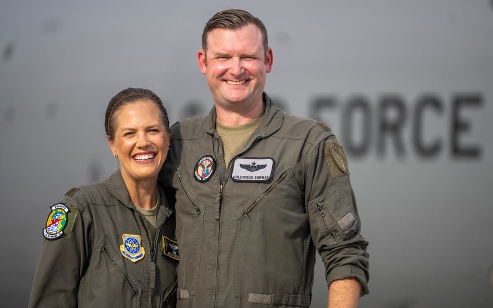 A dual-military Air Force pilot couple stands together at MacDill Air Force Base