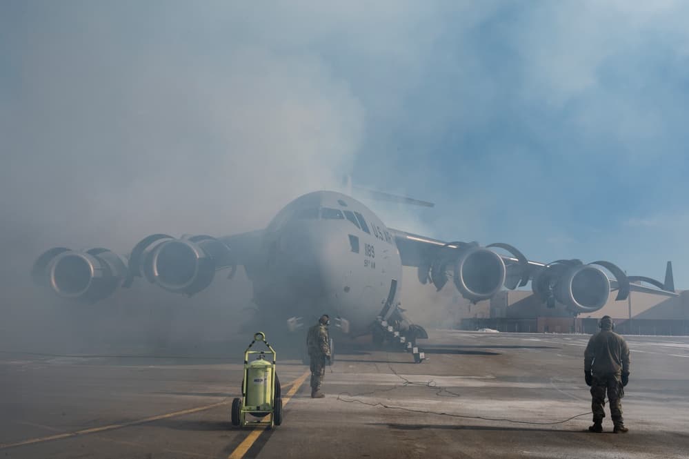 Air Force Reserve maintenance technicians performing aircraft maintenance