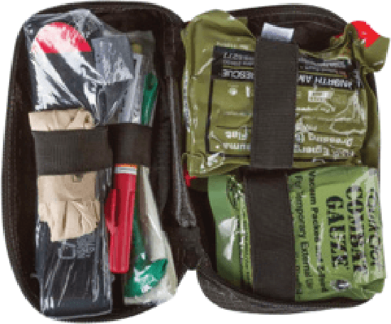 Fig 40-1: Open Joint First Aid Kit (JFAK) and Individual First Aid Kit (IFAK) showing tourniquets, hemostatic gauze, pressure dressings, and trauma supplies.