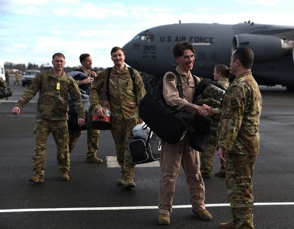 Airman reuniting with family after deployment return