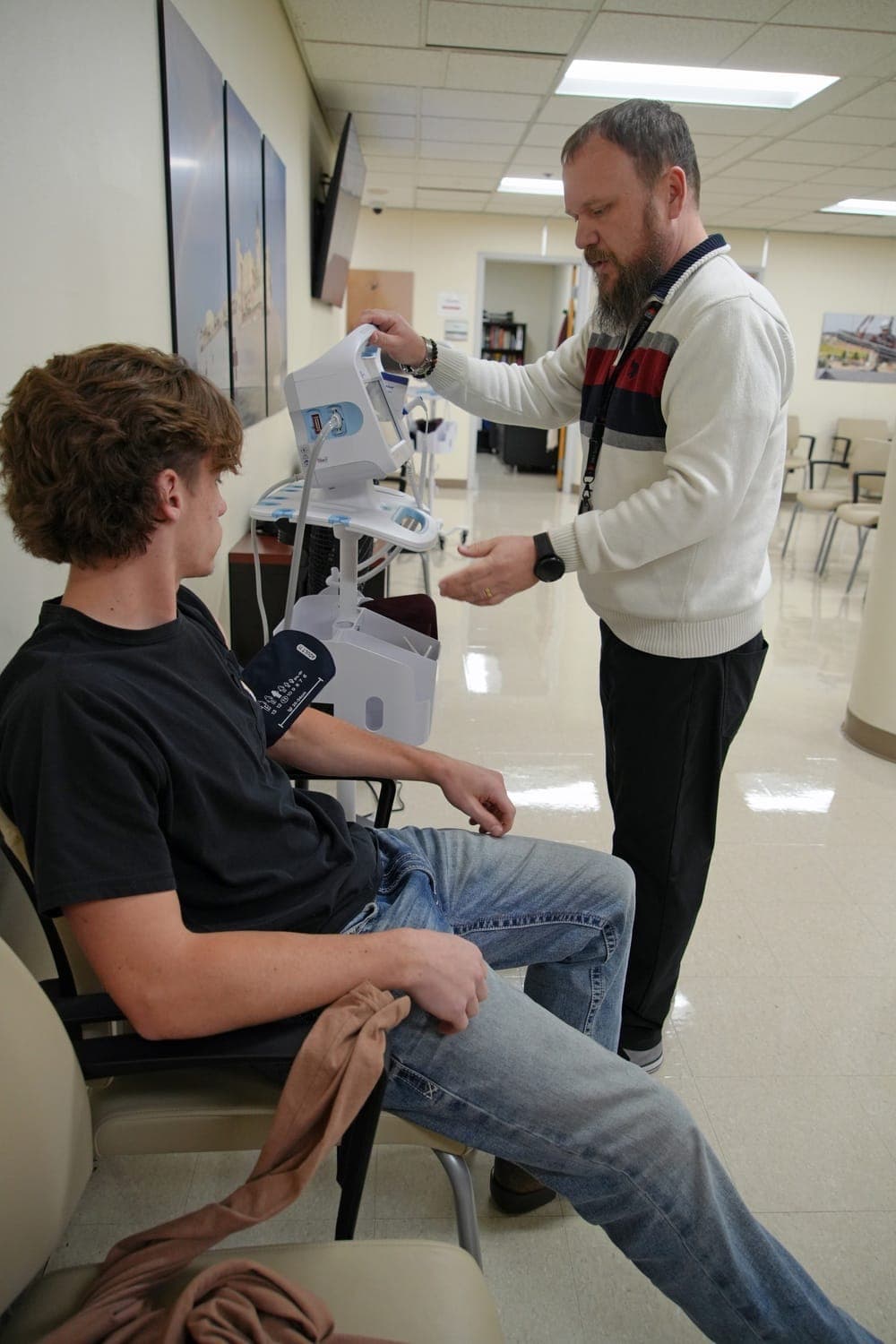 Applicant being measured for height and weight at MEPS