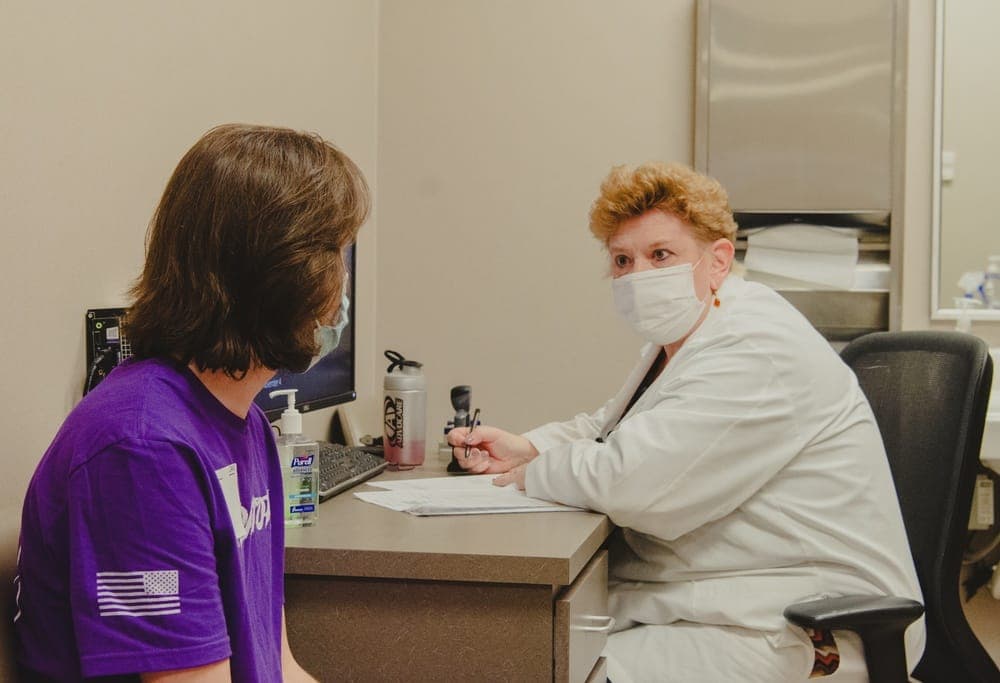 Medical technician conducting examination at a Military Entrance Processing Station
