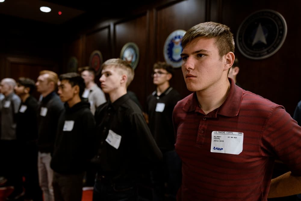 Military applicants processing paperwork on ship day at MEPS