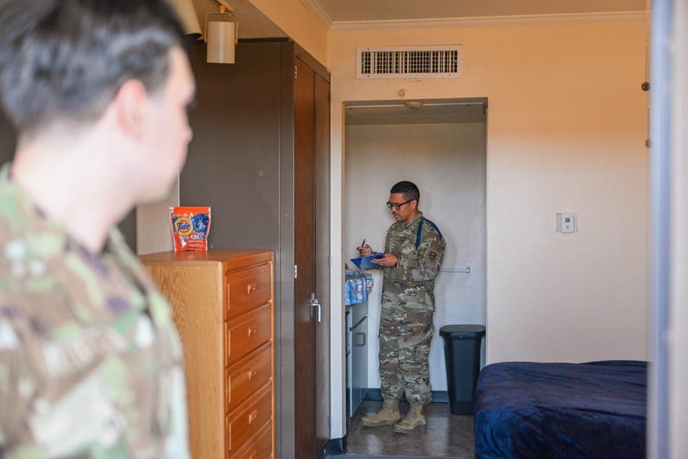 An MTL conducting a dormitory room inspection at a technical training base