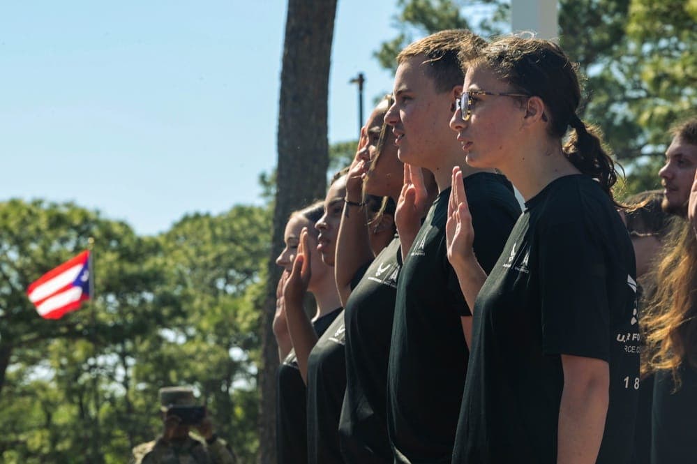 Thirty Air Force Delayed Entry Program members taking the oath of enlistment at Hurlburt Field memorial air park