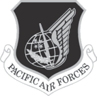 Pacific Air Forces (PACAF) emblem — silver wing with globe on a black shield