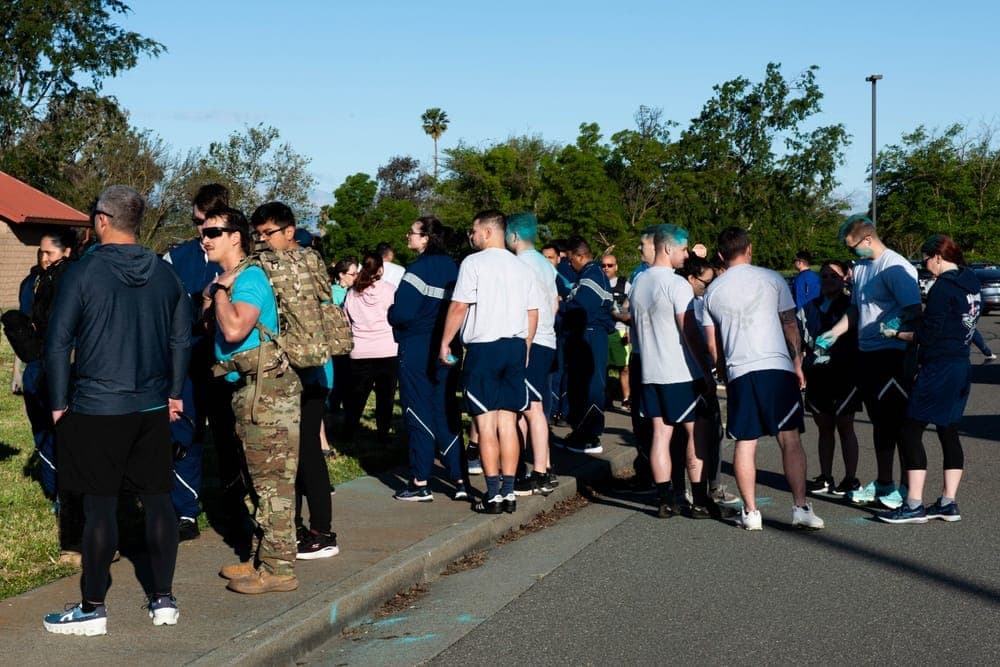 Airmen participating in Sexual Assault Awareness Month event at Air Force base