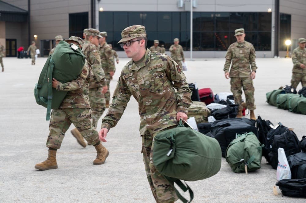 Airmen boarding a chartered flight from Lackland AFB to their technical training base