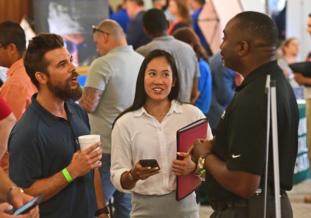 Service members and employers networking at a Hiring Our Heroes career event at Joint Base Charleston