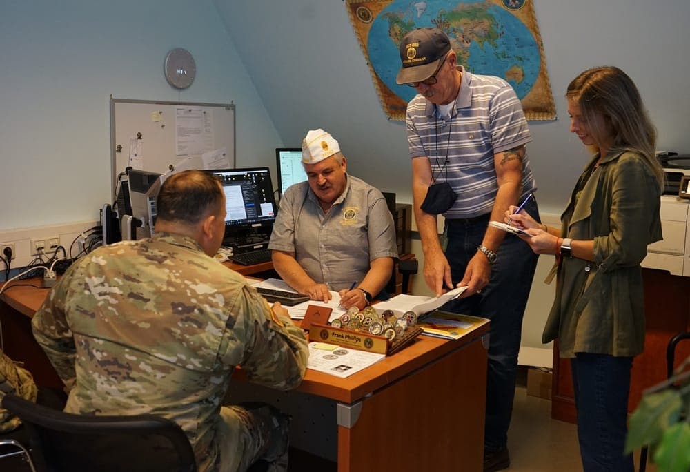 A veteran meeting with a VSO claims representative at a VA regional office